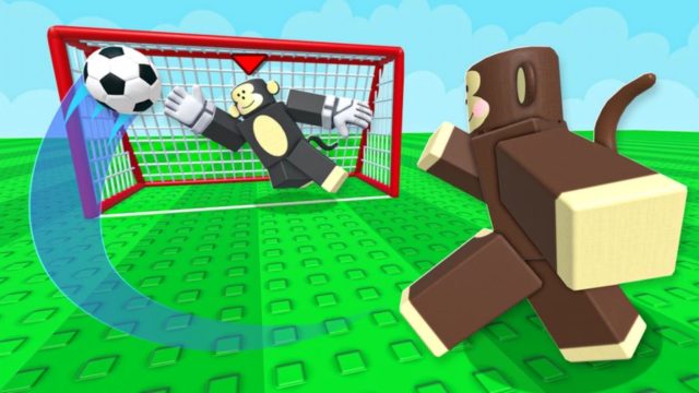 Monkey Soccer player shoots as a goalkeeper dives beside the red goal.